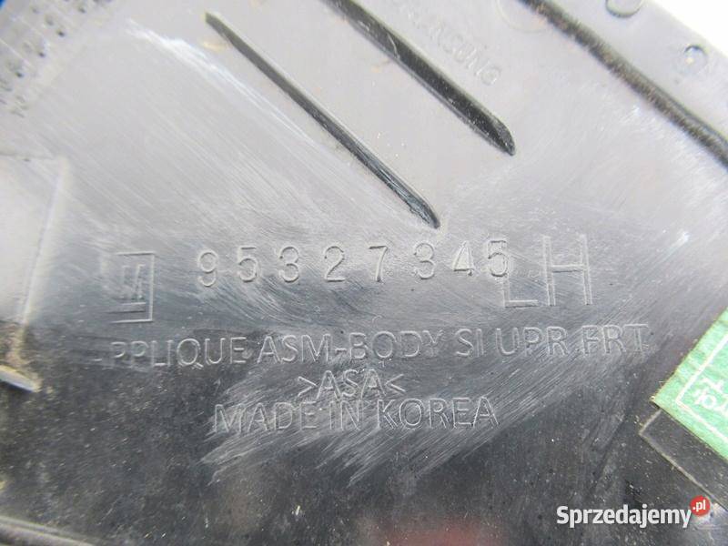 TRÓJKĄT BŁOTNIKA OPEL MOKKA LEWY 95327345 Listwy i nakładki