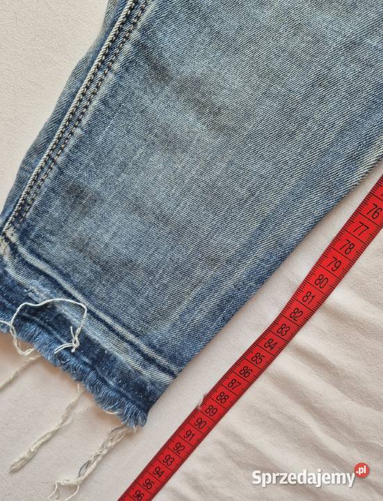 Spodnie jeansowe szarpane z dziurami Brzesko