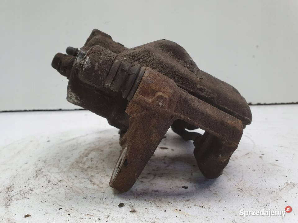 Toyota Corolla XII E21 LEWY PRZEDNI ZACISK osobowe Rudka