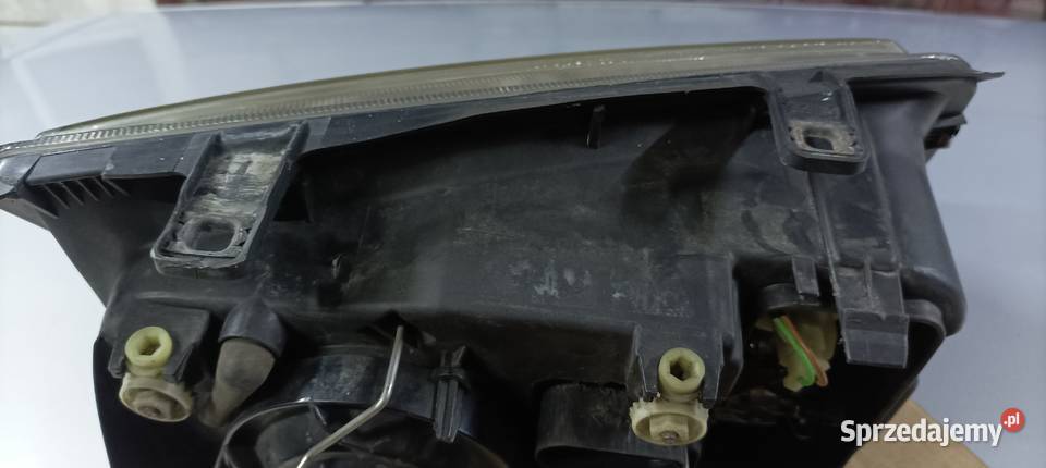 VW Bora lampy przednie oryginał Hella Oświetlenie Leopoldów