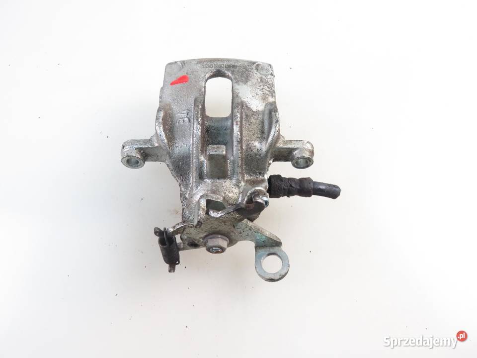 ZACISK LEWY TYŁ FORD FOCUS MK1 Turnier 18 16V