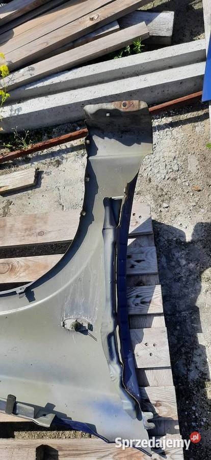 Blotnik lewy przód Nissan Almera n16 polift