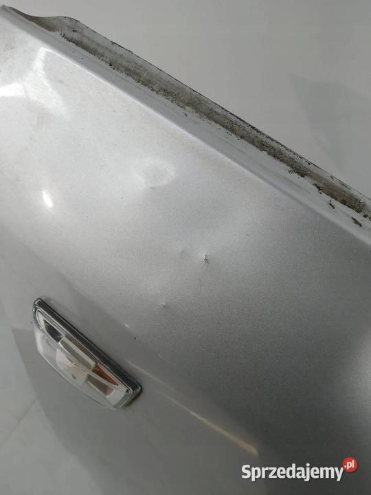 BŁOTNIK PRAWY PRZÓD SREBRNY Z157 Opel Zafira II