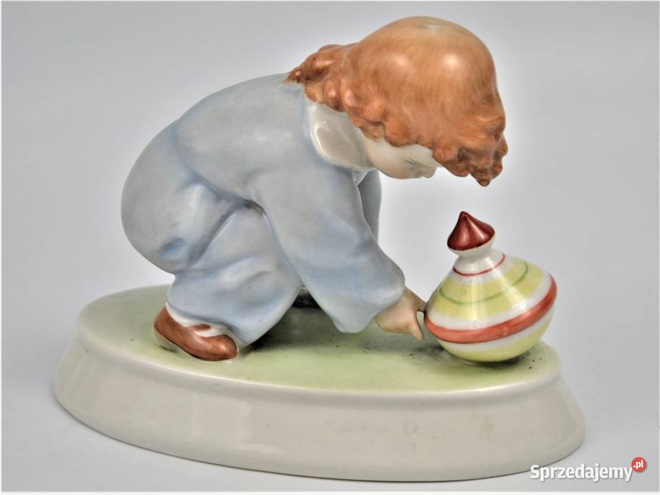 dziecko bawiące się bączkiem projekt Sinko Warszawa