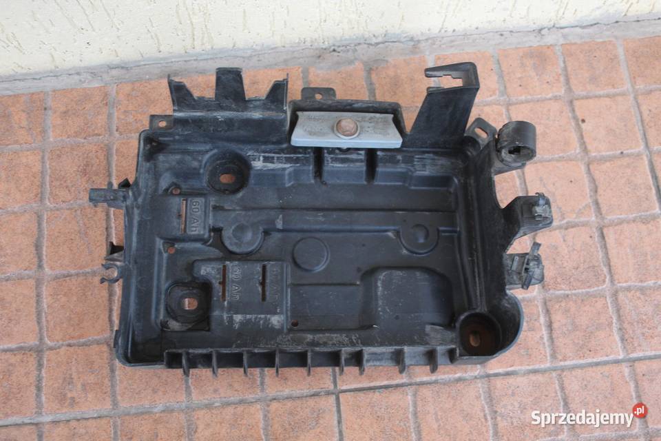 PODSTAWA AKUMULATORA OPEL CORSA D 10 13235642 Części samochodowe wielkopolskie sprzedam