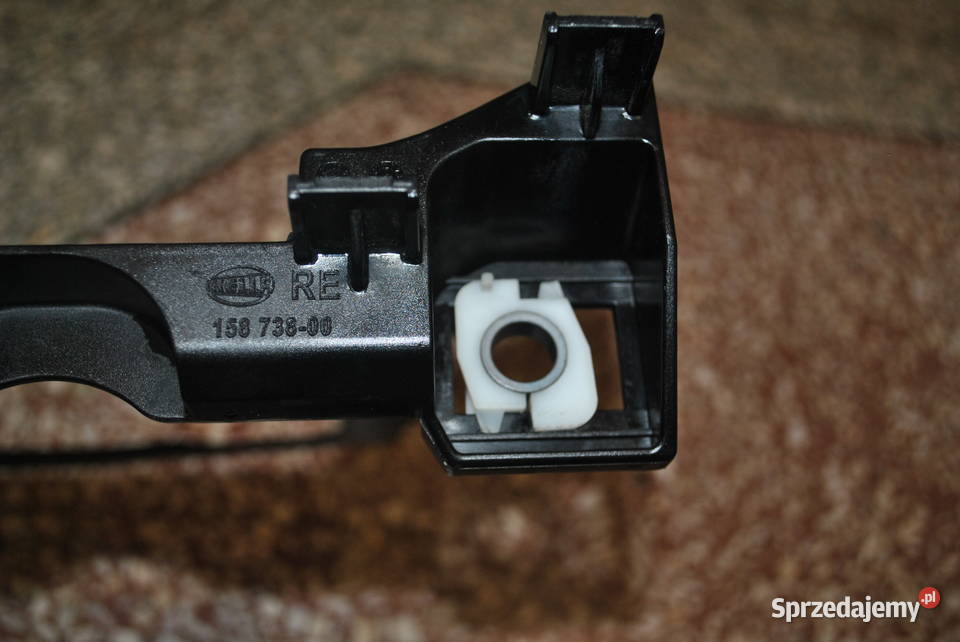 Ślizg lampy prawy przód BMW E60 E61 uchwyt lampy Poręba