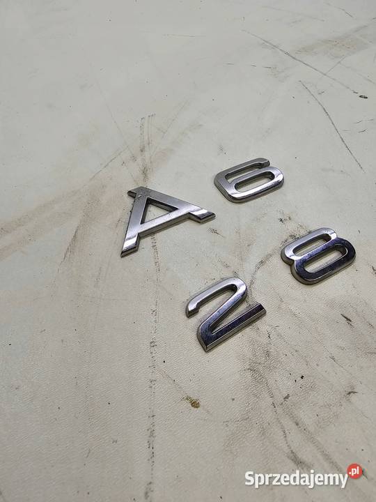 EMBLEMAT KLAPY TYŁ AUDI A6 C6 28 ORYGINAŁ Przystajń