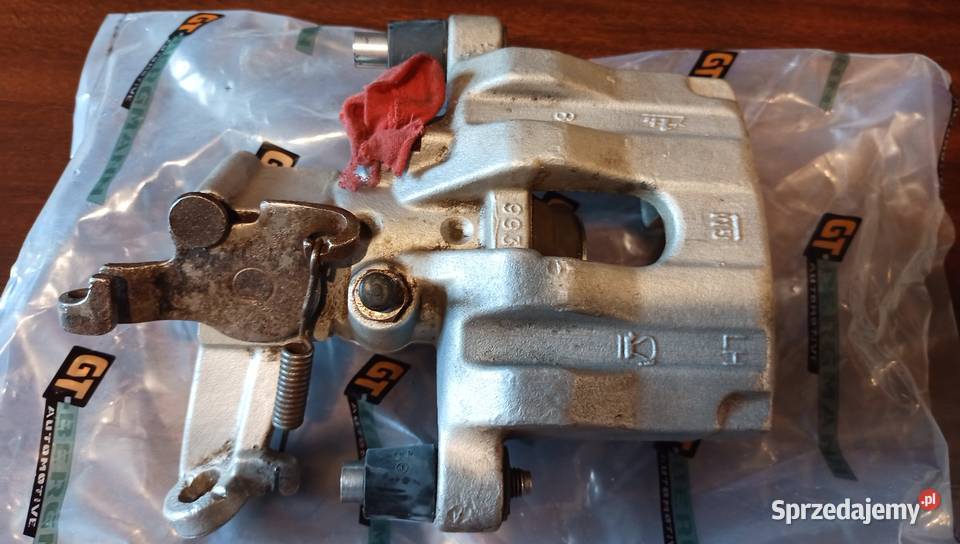 Oryginalny Zacisk GM hamulca LewyTył Opel Vectra Szczerbice