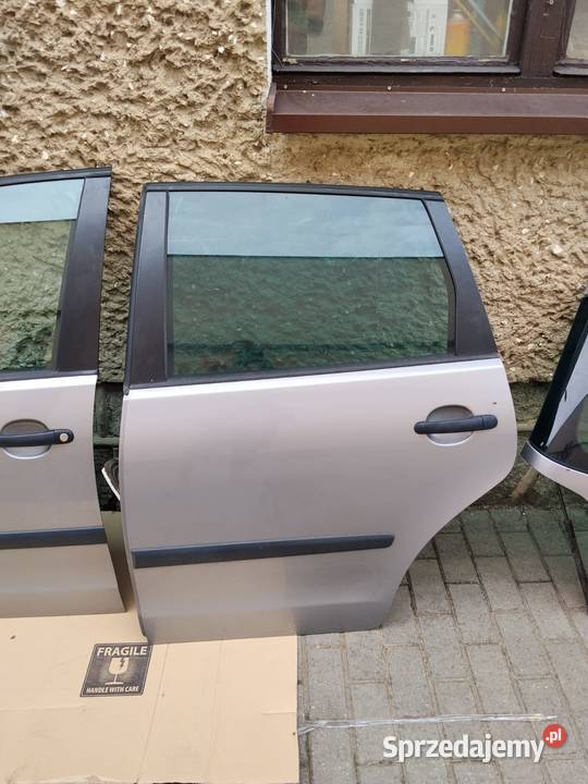 Drzwi VW Polo IV 9N 9N3 kompletne srebrne LA7W Zbąszyń