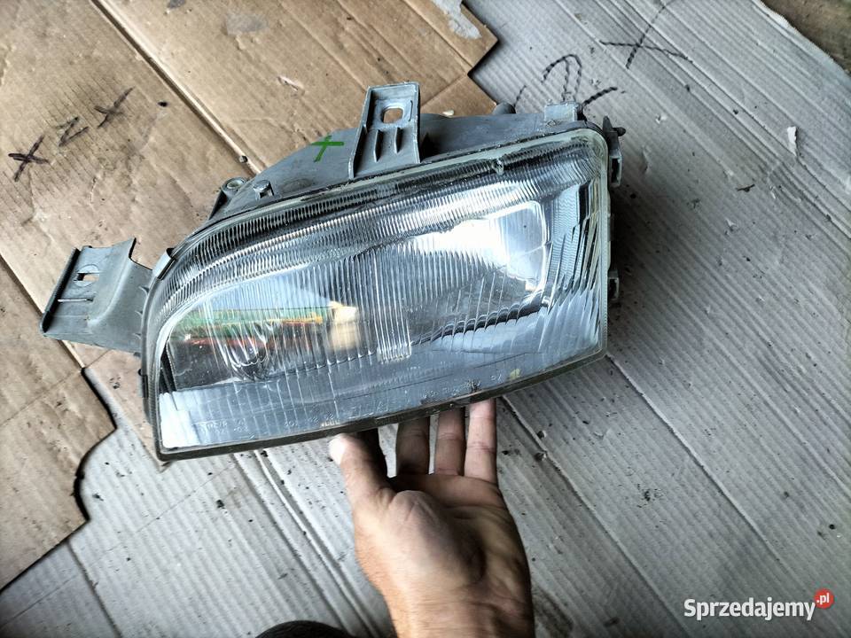 LAMPA PRZÓD PRZEDNIA LEWA REFLEKTOR FIAT PUNTO 1 Kamień-Kolonia