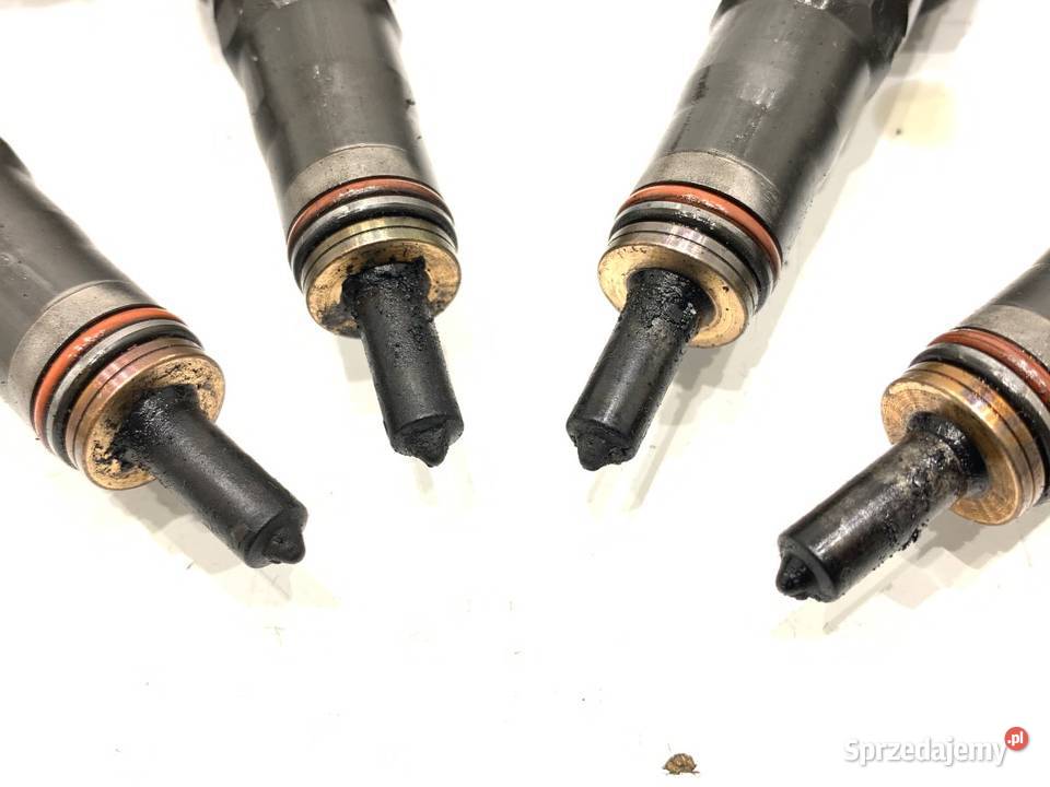 WTRYSKIWACZE KOMPLET VW GOLF V 038130073BN 19 Części samochodowe