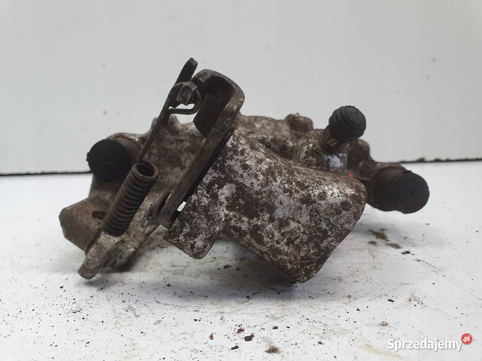 Toyota Yaris IV TYLNY ZACISK HAMULCOWY lewy tył