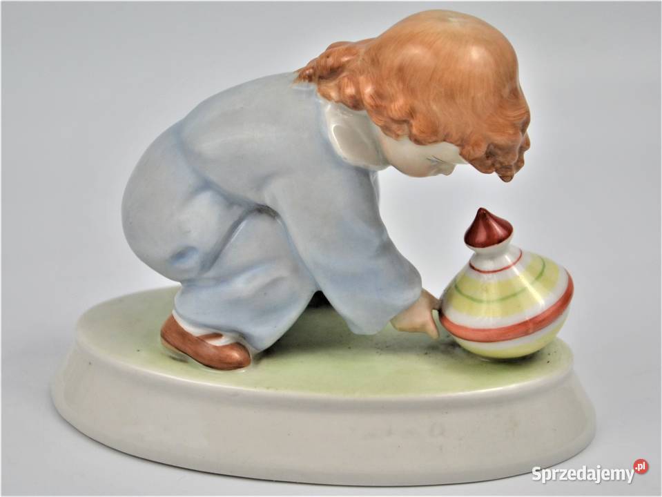 dziecko bawiące się bączkiem projekt Sinko Warszawa