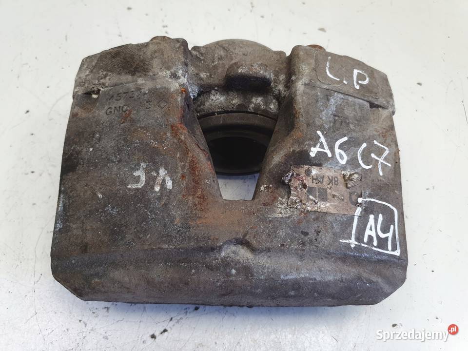 Audi A6 C7 PRZEDNI ZACISK HAMULCOWY lewy przód