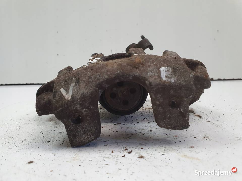 Toyota Yaris IV TYLNY ZACISK HAMULCOWY lewy tył