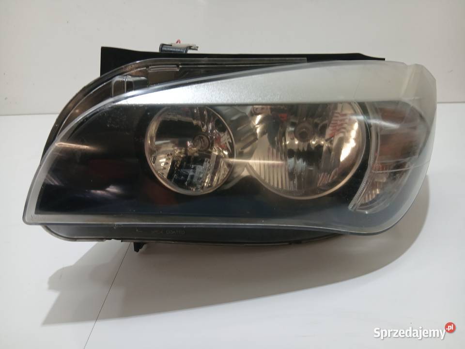 LAMPA LEWA PRZEDNIA BMW X1 E84 7357447 BAV osobowe Lampy przednie