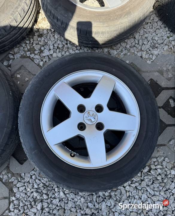 Felgi Peugeot 4x108 opony 1856515 2023r 206 207 Krępiec