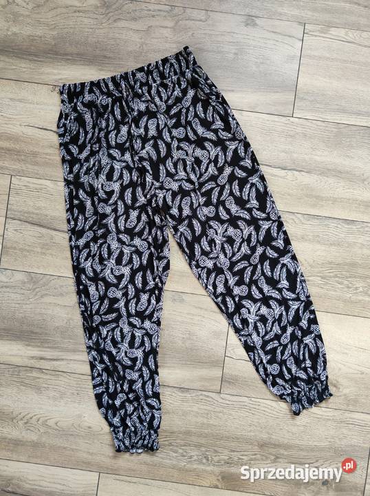 Materiałowe spodnie w pióra 40 42 44 46 Spodnie