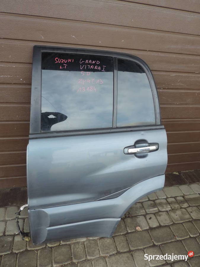 SUZUKI GRAND VITARA 1 5D DRZWI LEWY TYŁ ZY4C13 Rok produkcji 2004 Nowy Sącz