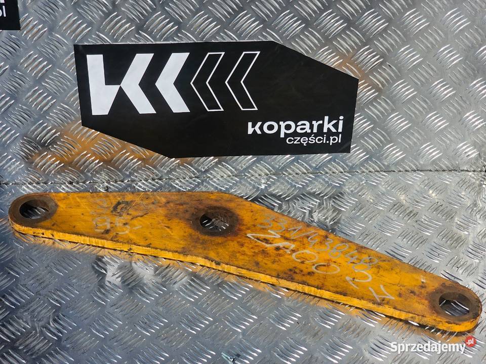 Łącznik ramienia przedniego w koparkoładowarkach