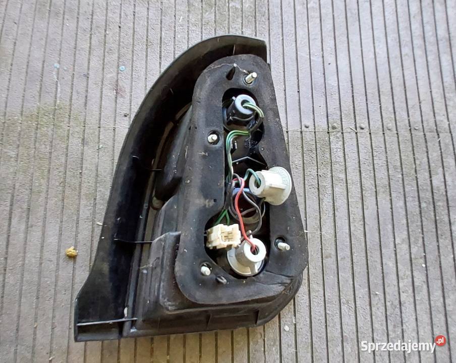 Mitsubishi Colt 1999 20002002 lampa tył lewa Byków