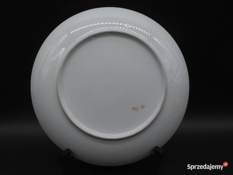 Dekoracyjny talerz z wizerunkiem dziewczynki i wielkopolskie Raszków