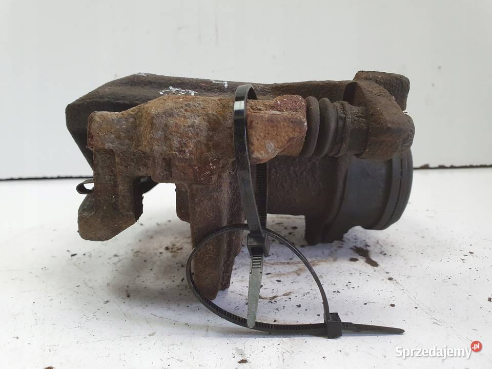 Lexus UX TYLNY ZACISK HAMULCOWY lewy tył