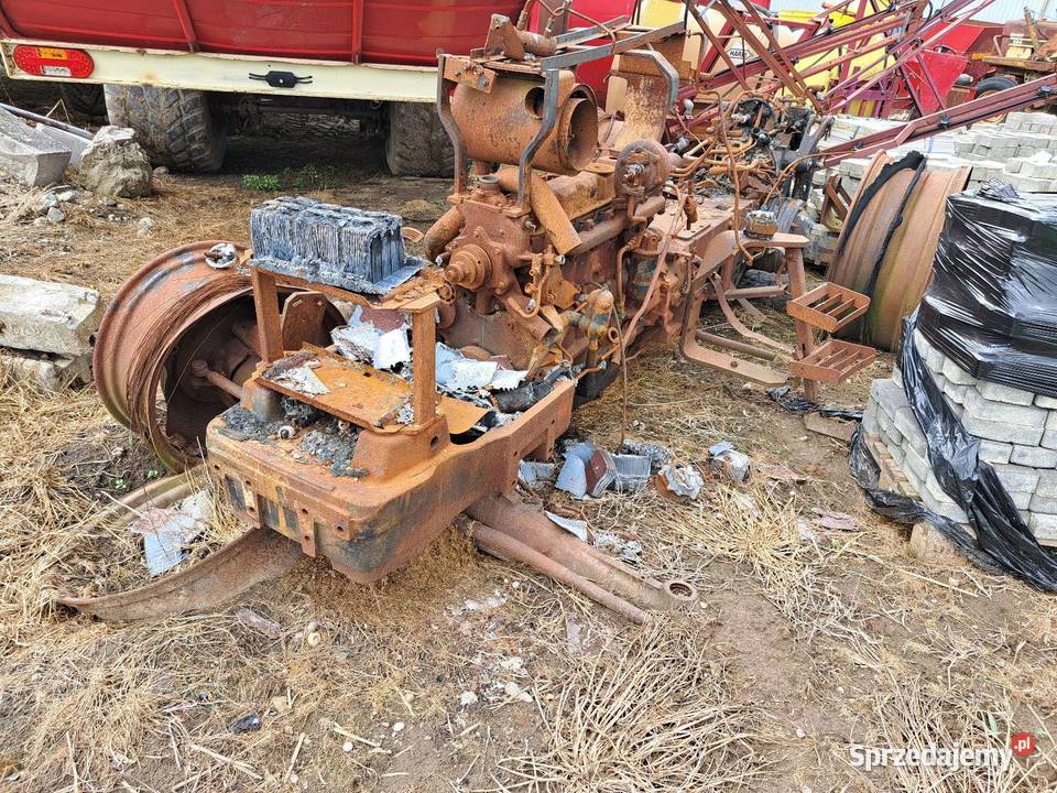 Ciągnik Holland M115 i pochodne części sprzedam