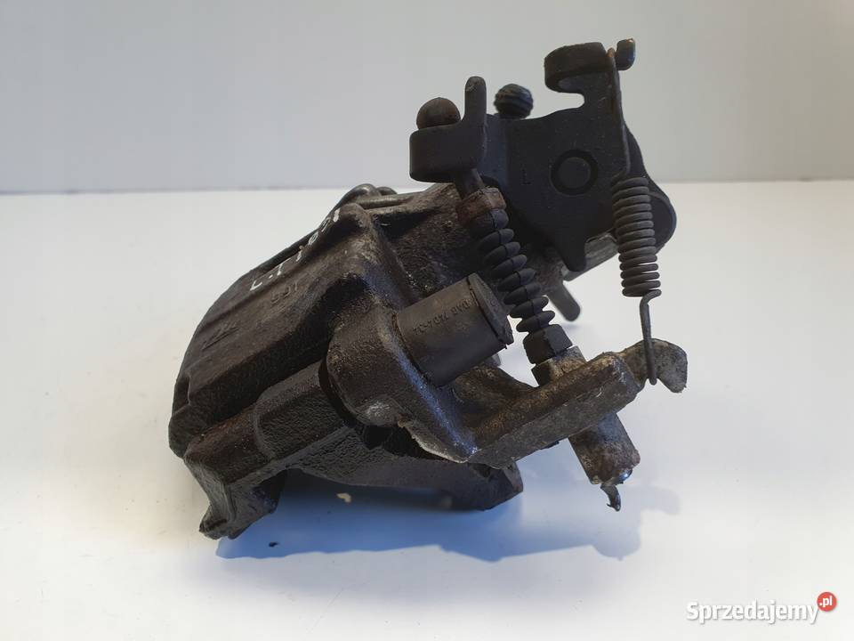 Toyota Yaris III TYLNY ZACISK HAMULCOWY lewy tył