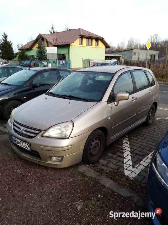 Suzuki Liana chatchback beżowy metal 16 Benzyna Pionki