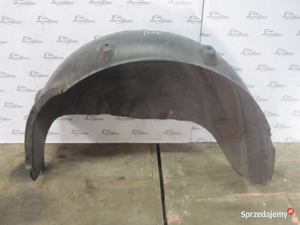VOLKSWAGEN CADDY III nadkole lewe tył 2K5810971A