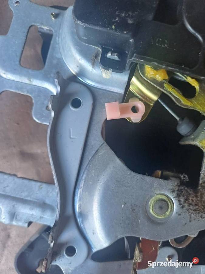 Kia Carnival lll zamek drzwi lewy tylni Nowy Tomyśl