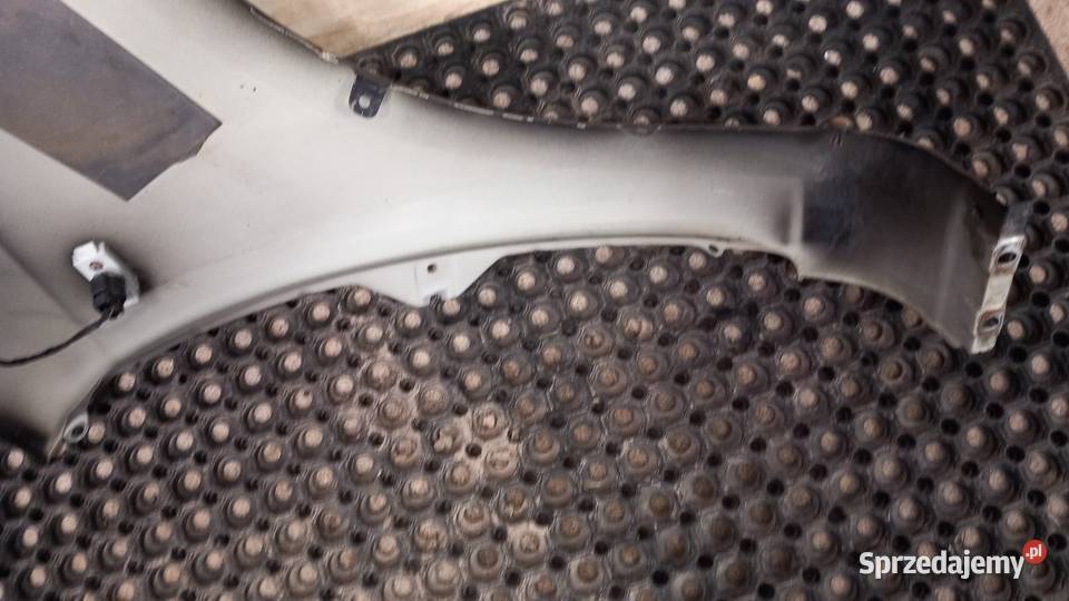 KIA CARENS III BŁOTNIK PRZÓD LEWY 9H