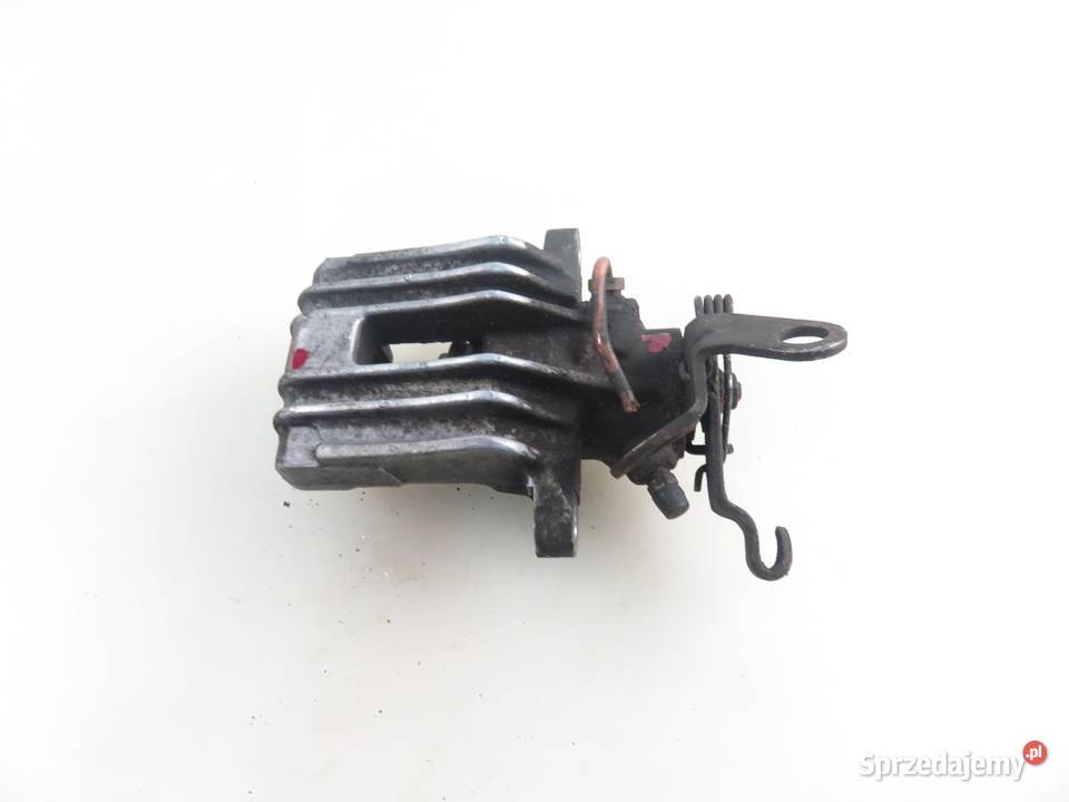 ZACISK LEWY TYŁ AUDI A3 8P 20 TDI Układ hamulcowy