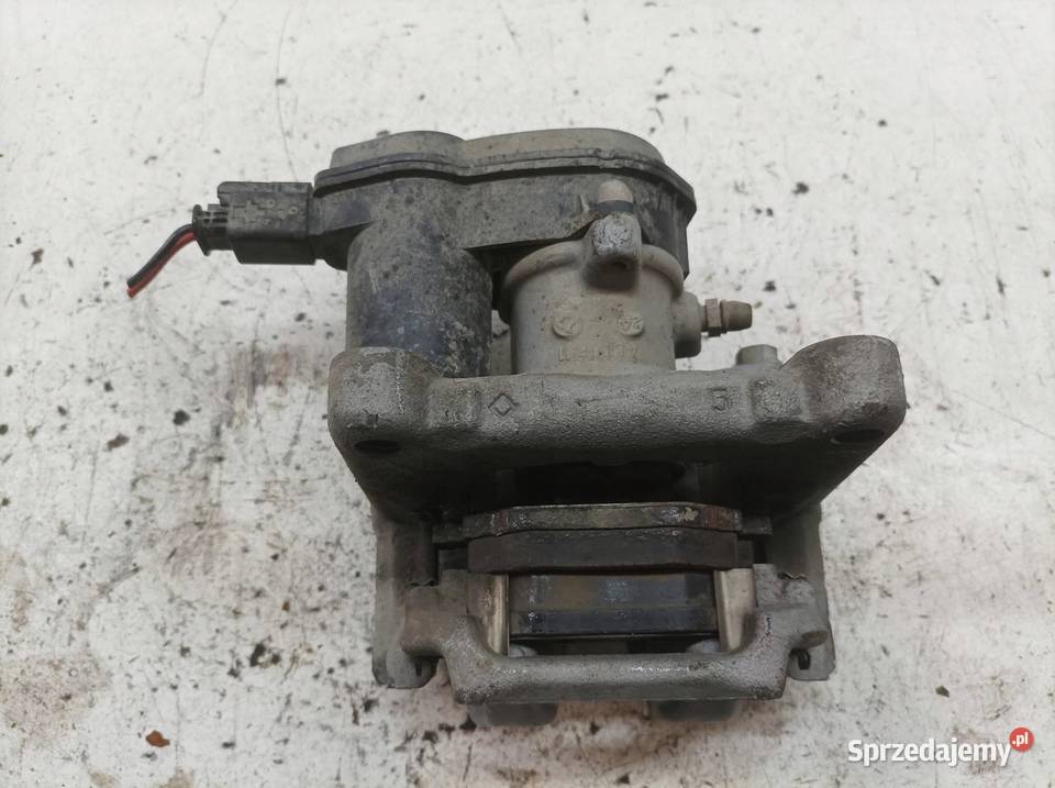 ZACISK HAMULCOWY LEWY TYŁ ELEKTRYCZNY 12 B sprzedam