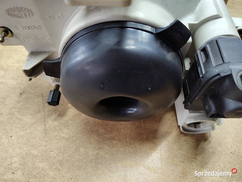 Reflektor lewy Seicento oryginał Carello osobowe wielkopolskie