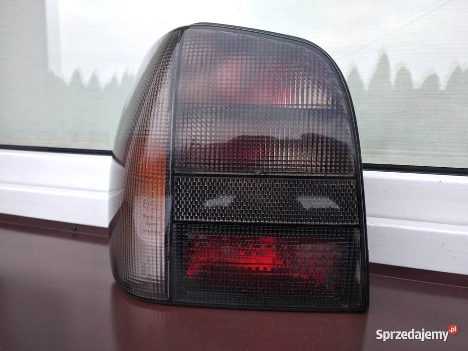 VW Polo III 6N lampy tył tylne Hella Black prawa Sieradz