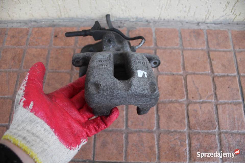 ZACISK HAMULCOWY PRAWY TYŁ VW PASSAT B6 20 TDI Motoryzacja