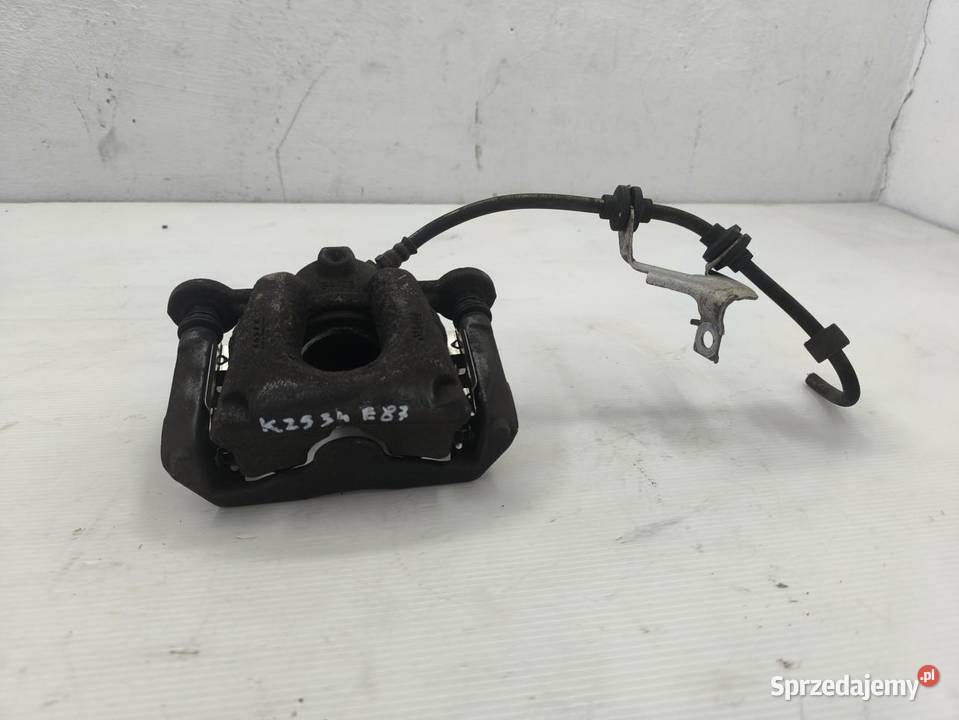ZACISK LEWY TYŁ BMW 1 E87 E81 LIFT 16 osobowe