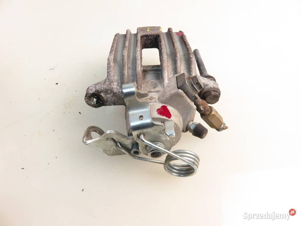 ZACISK LEWY TYŁ SEAT TOLEDO II 1M2 18 20V 125 Motoryzacja