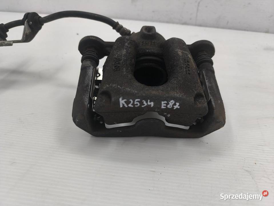 ZACISK PRAWY TYŁ BMW 1 E87 E81 LIFT 16