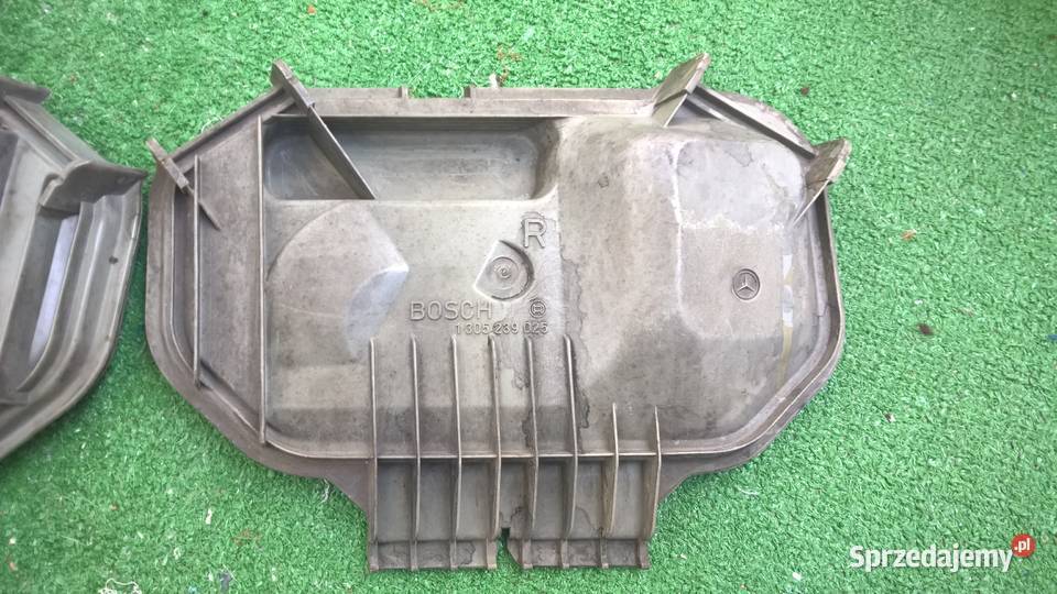 Zaślepki dekielki lamp przód Mercedes W124 Hella osobowe Chełm