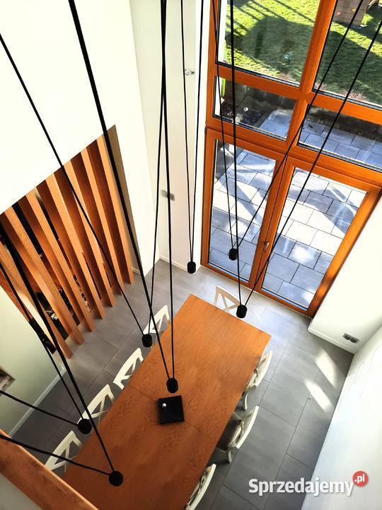 salon z antresolą długa lampa wisząca LUKLIGHT Rzeszów