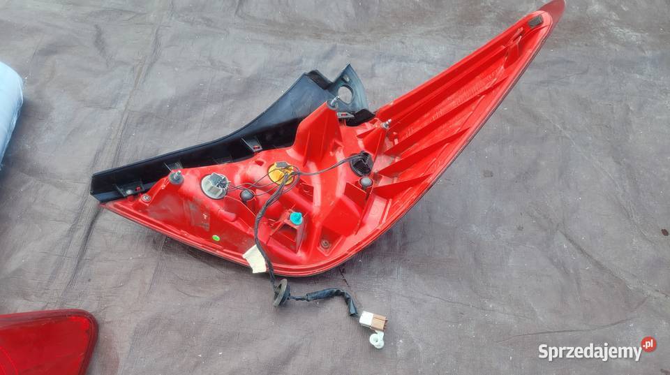 NISSAN TIIDA 5D LAMPA TYŁ LEWA 26555EM01A HELLA Lampy tylne Ruda Śląska