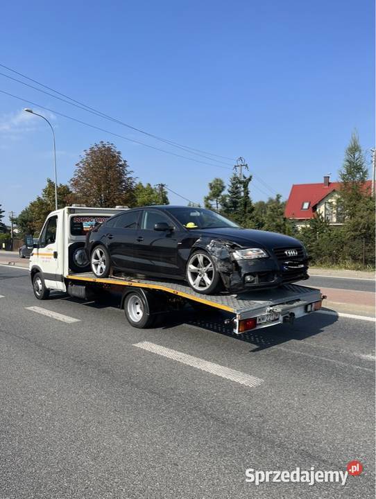 pomoc drogowa auto laweta transport maszyn Zakręt