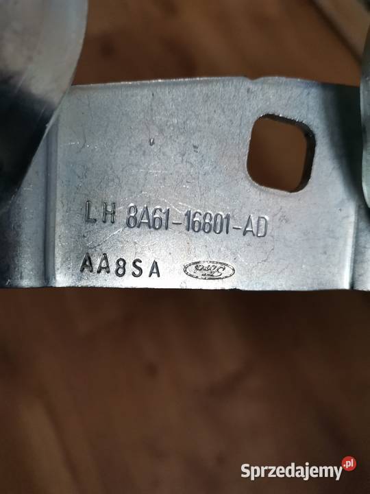 FORD FIESTA Mk7 NOWY LEWY ZAWIAS MASKI Międzychód