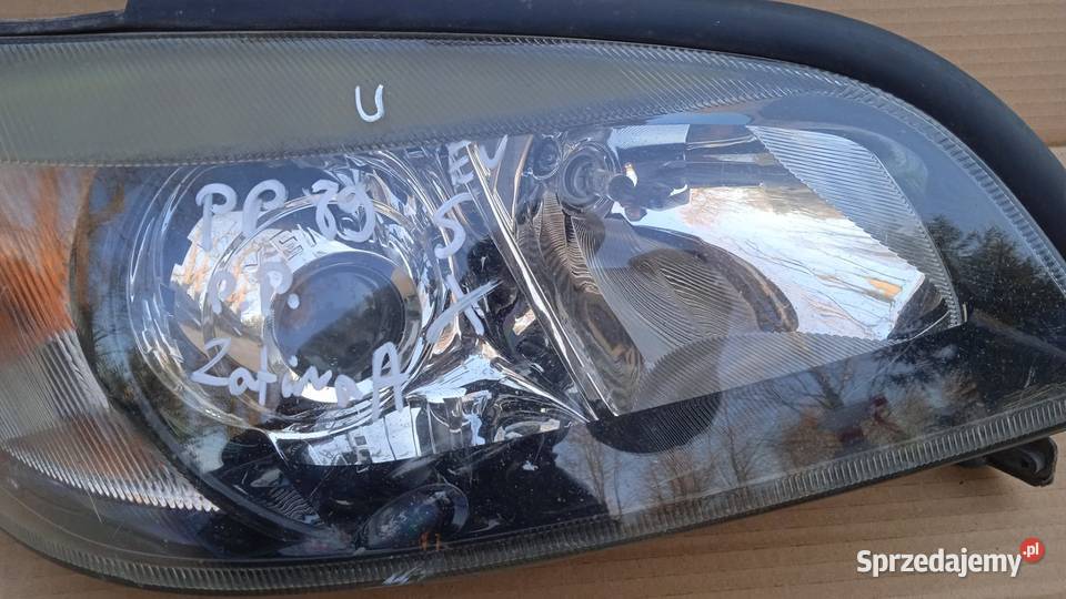 ZAFIRA A LAMPA PRZÓD PRAWA SOCZEWKA XENON EU Części samochodowe wielkopolskie