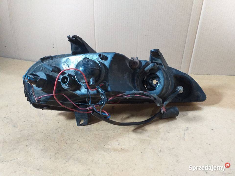 131G OPEL TIGRA Reflektor Lampa przednia lewa Włoszczowa