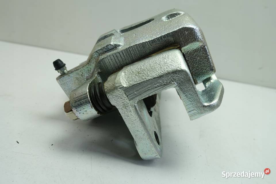 Kia Carnival I 29 CRDI PRZEDNI ZACISK HAMULCOWY osobowe Rudka