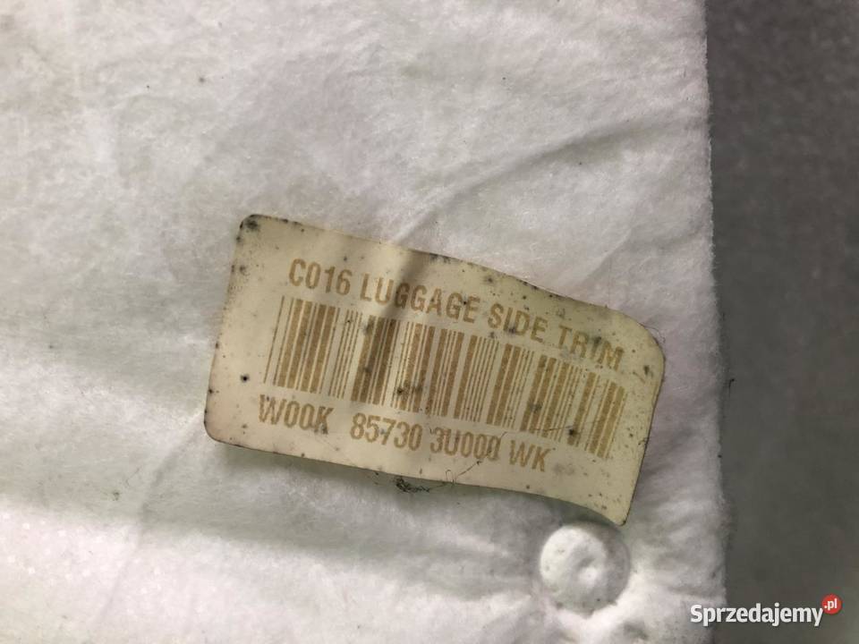 BOCZEK BAGAŻNIKA 857303U000 LEWY KIA SPORTAGE Wyposażenie wnętrza